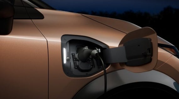 Close-up image of charging cable plugged in | Wood Motor Nissan in Harrison AR