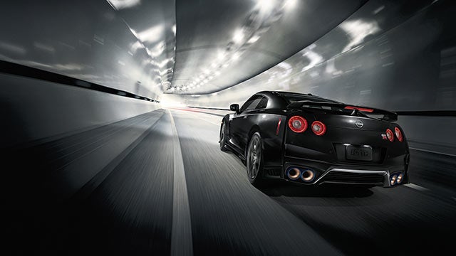 2023 Nissan GT-R seen from behind driving through a tunnel | Wood Motor Nissan in Harrison AR